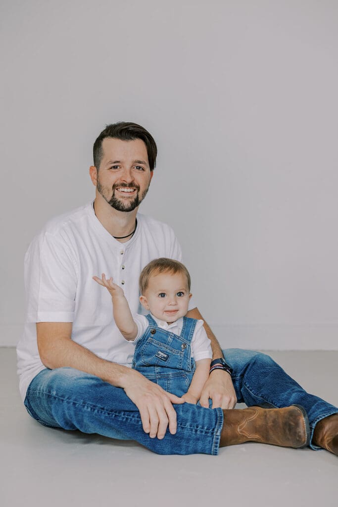 Cake smash photography in Richmond session featuring baby Lincoln enjoying his first birthday cake at our studio.