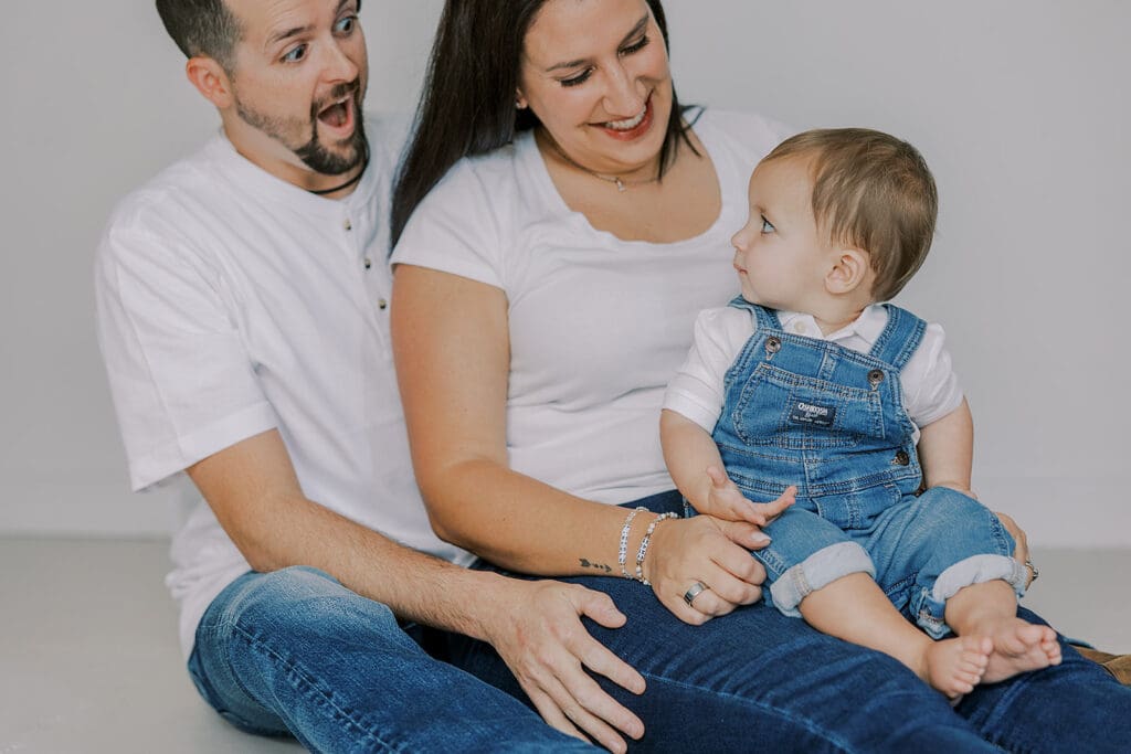 Cake smash photography in Richmond session featuring baby Lincoln enjoying his first birthday cake at our studio.