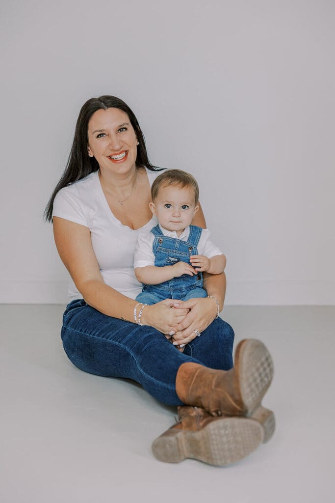 Cake smash photography in Richmond session featuring baby Lincoln enjoying his first birthday cake at our studio.