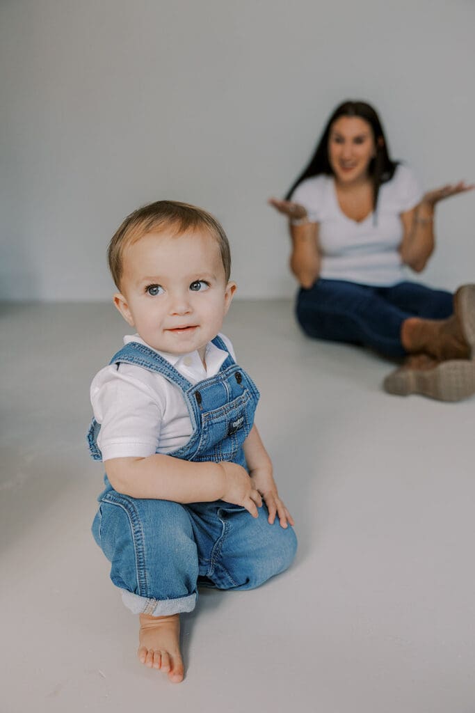 Cake smash photography in Richmond session featuring baby Lincoln enjoying his first birthday cake at our studio.