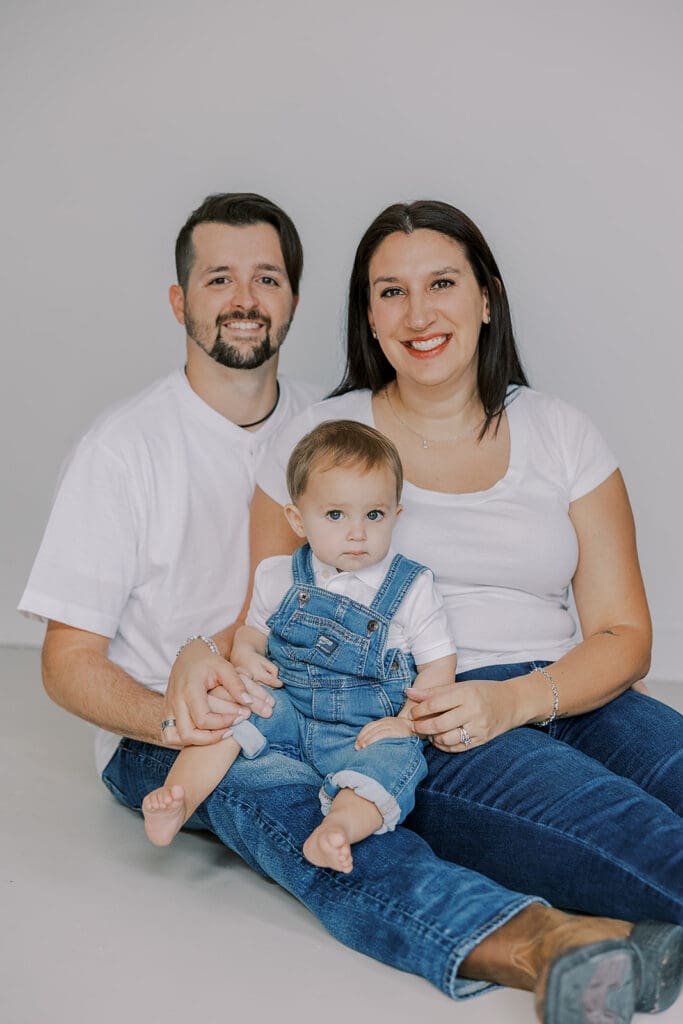 Cake smash photography in Richmond session featuring baby Lincoln enjoying his first birthday cake at our studio.