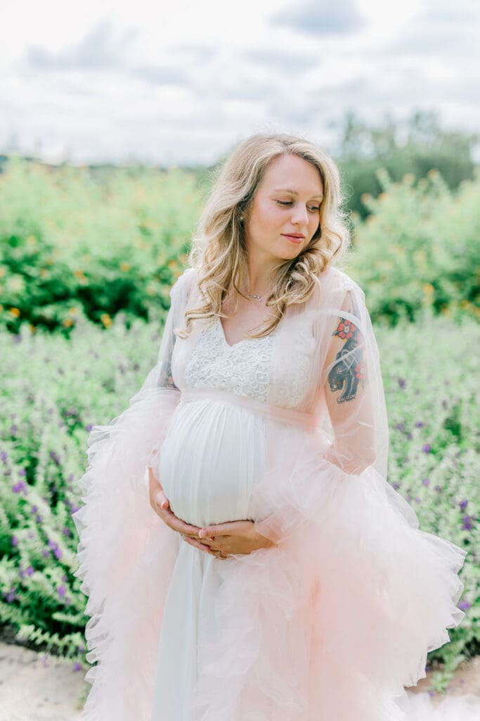 Maymont spring maternity photography featuring Cameron in a flowing pink gown surrounded by blooming gardens.