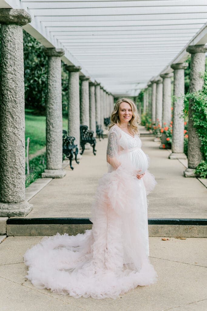 Maymont spring maternity photography featuring Cameron in a flowing pink gown surrounded by blooming gardens.