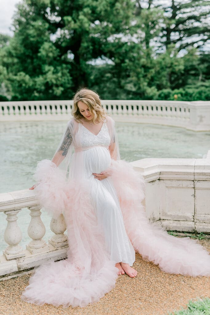 Maymont spring maternity photography featuring Cameron in a flowing pink gown surrounded by blooming gardens.