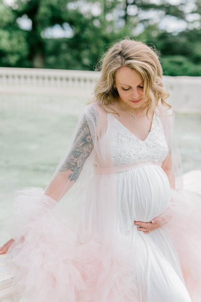 Maymont spring maternity photography featuring Cameron in a flowing pink gown surrounded by blooming gardens.