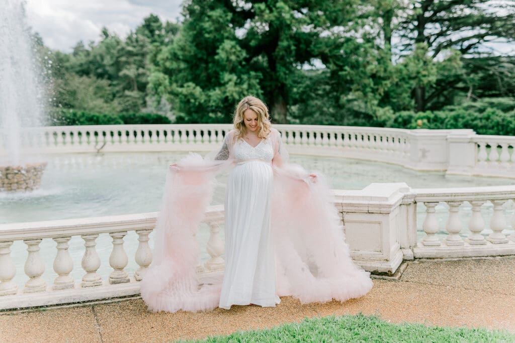 Maymont spring maternity photography featuring Cameron in a flowing pink gown surrounded by blooming gardens.