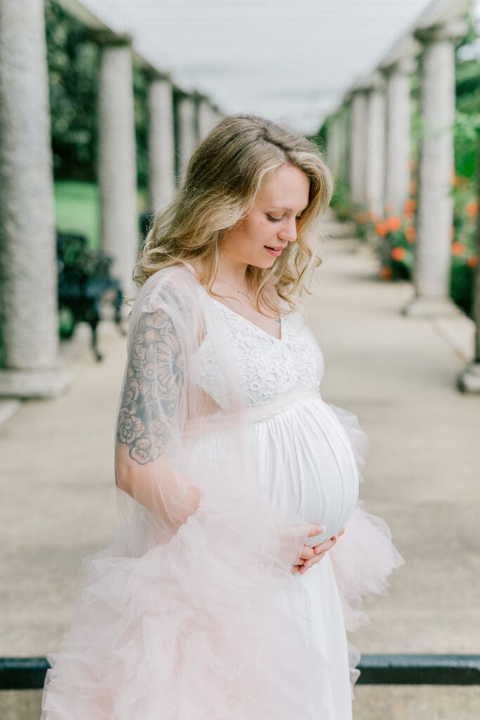 Maymont spring maternity photography featuring Cameron in a flowing pink gown surrounded by blooming gardens.