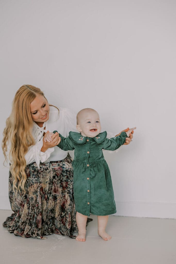 Richmond studio family session featuring the stylish Cooney family celebrating their daughter's first birthday with joyful expressions.