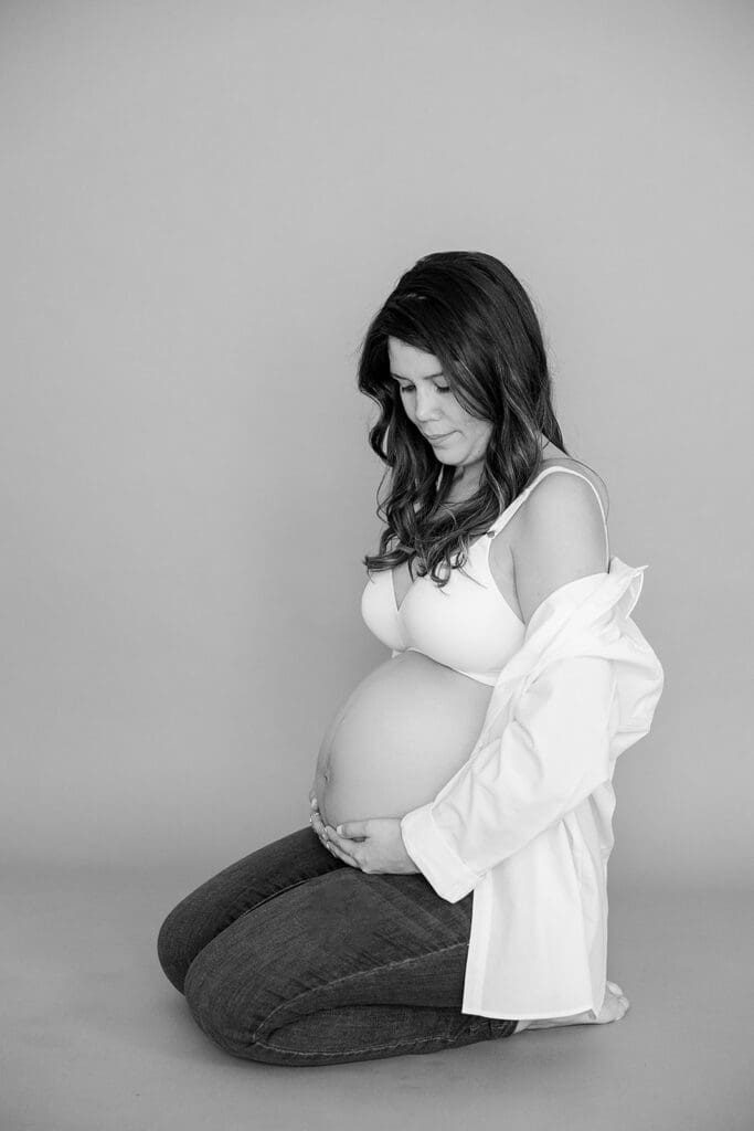 Studio maternity photography in Richmond showing the Holguins with flowers, ultrasound pictures and simple elegant backdrops.