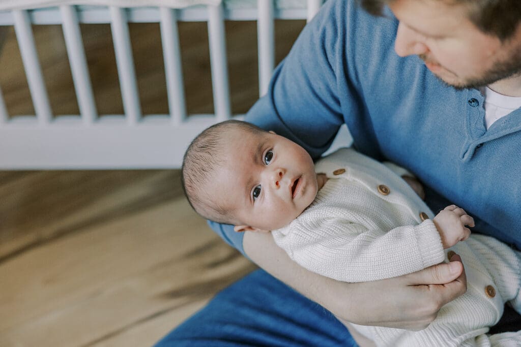 Richmond in-home newborn photographer session showing Baby Oliver with family, nursery details, and their dog.