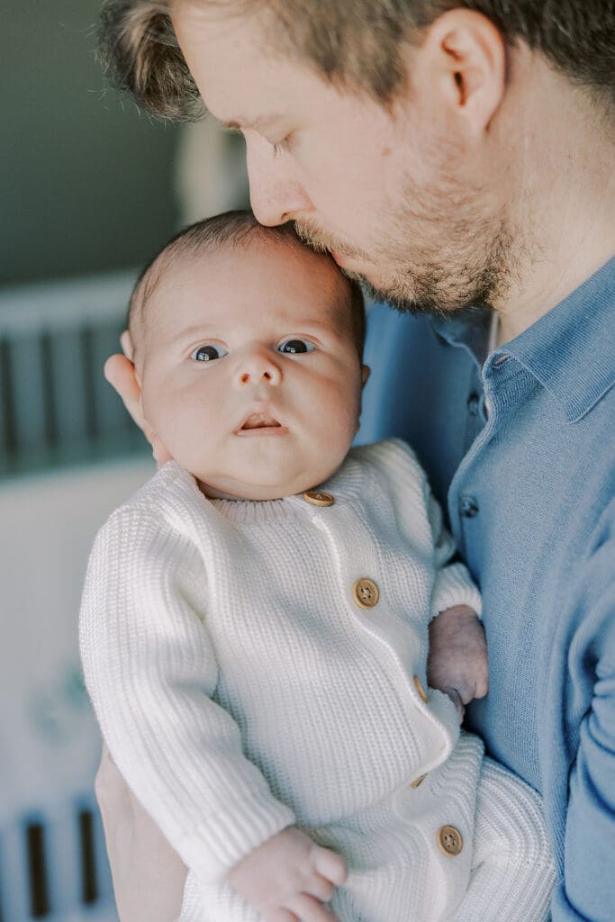 Richmond in-home newborn photographer session showing Baby Oliver with family, nursery details, and their dog.