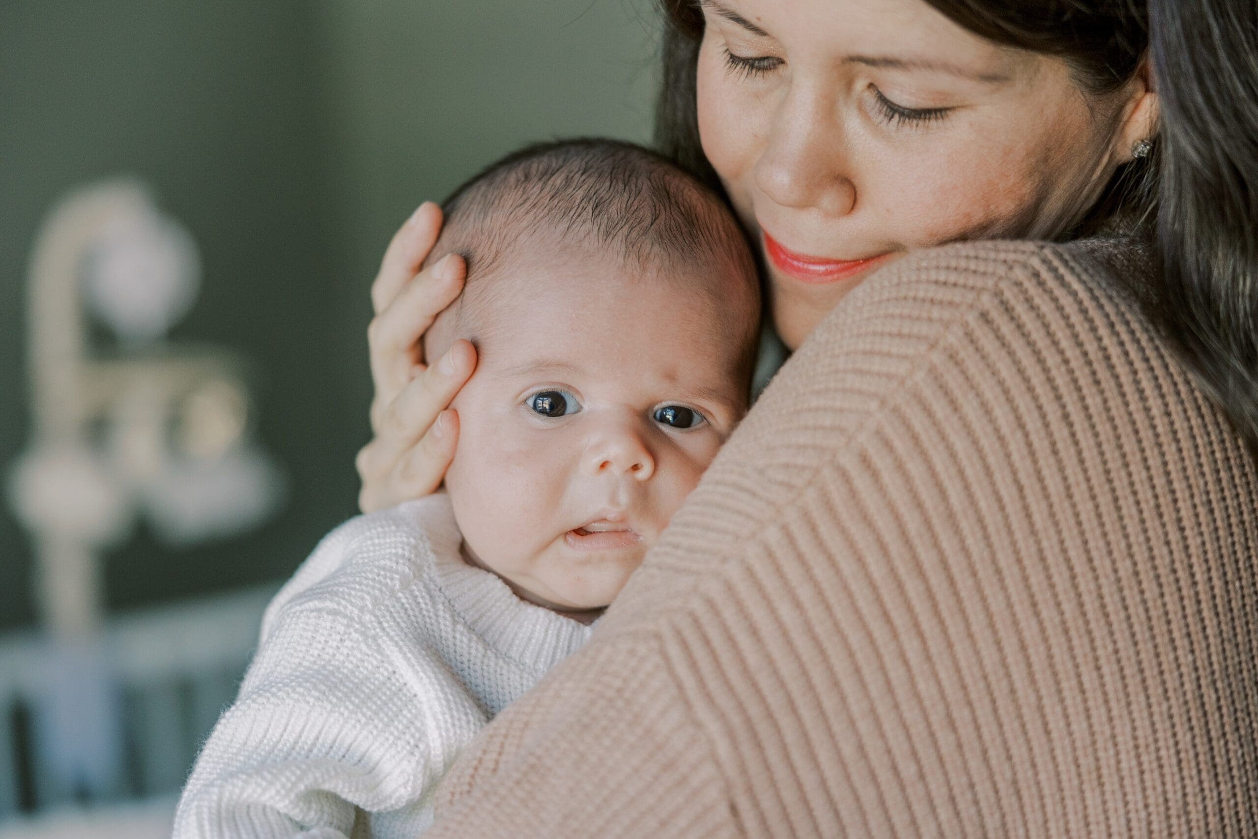 A mother and her baby during their newborn lifestyle session.