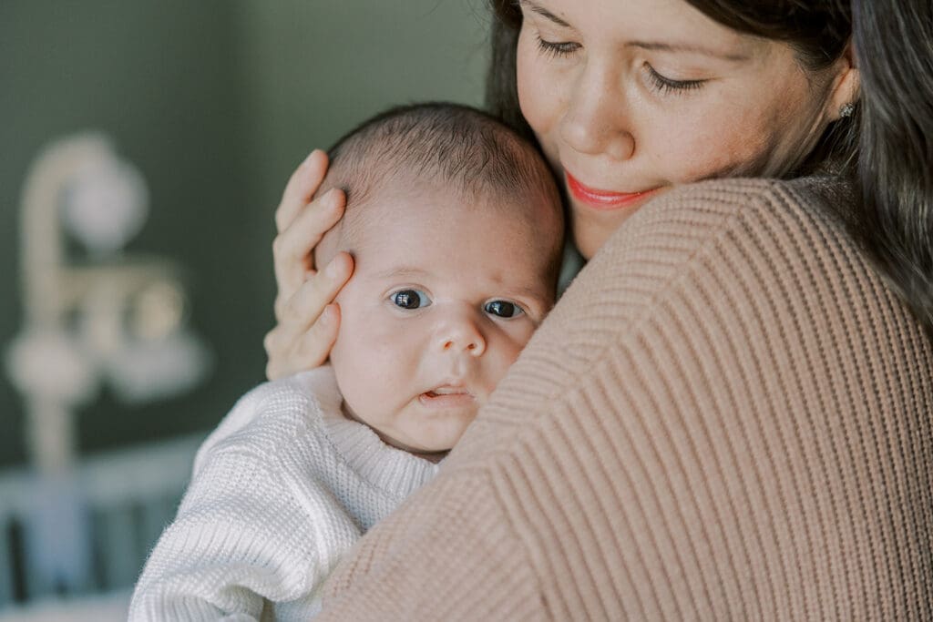 Richmond in-home newborn photographer session showing Baby Oliver with family, nursery details, and their dog.