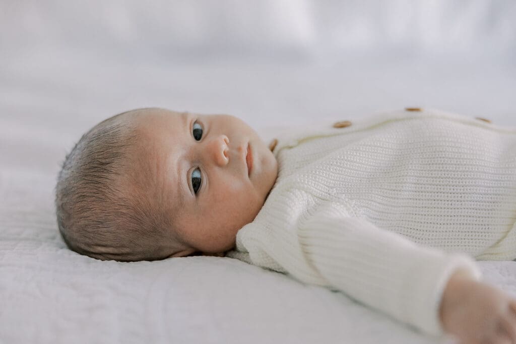 Richmond in-home newborn photographer session showing Baby Oliver with family, nursery details, and their dog.