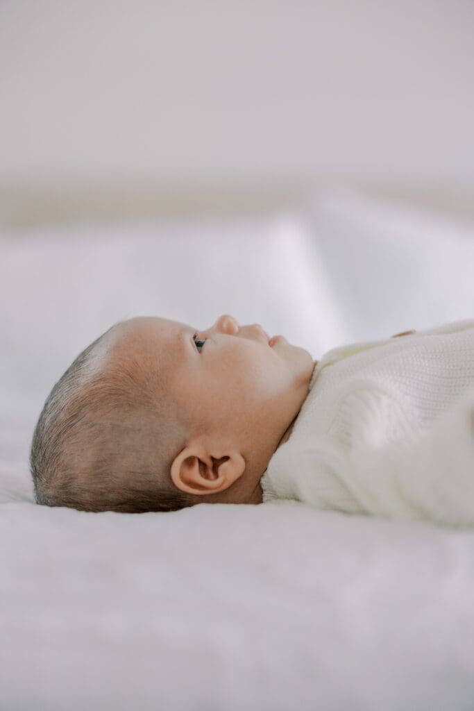 A baby poses during his newborn photography session.