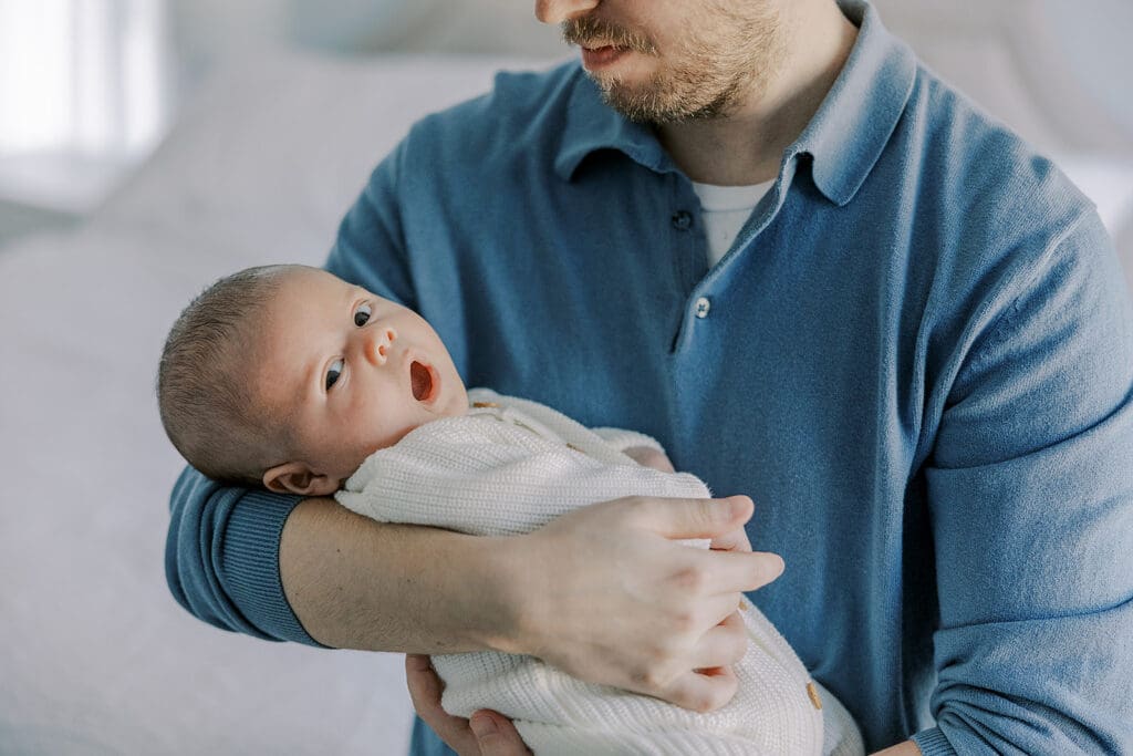 Richmond in-home newborn photographer session showing Baby Oliver with family, nursery details, and their dog.