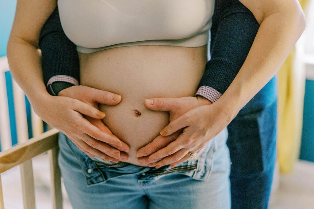 Richmond in-home maternity photography session showing the Quick family in their beautifully decorated home and nursery.