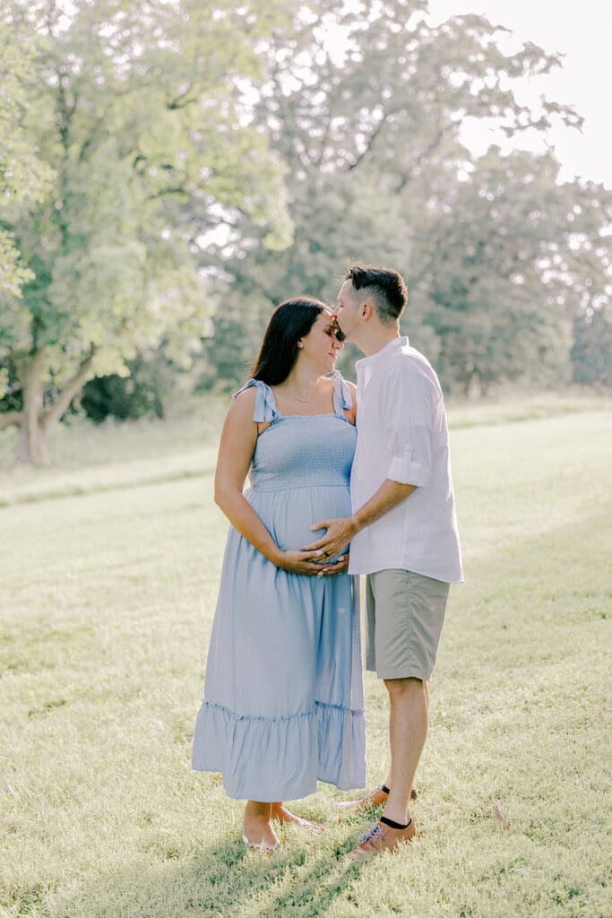 Maymont Richmond maternity photography session with the Barnes family surrounded by spring blooms and golden light.