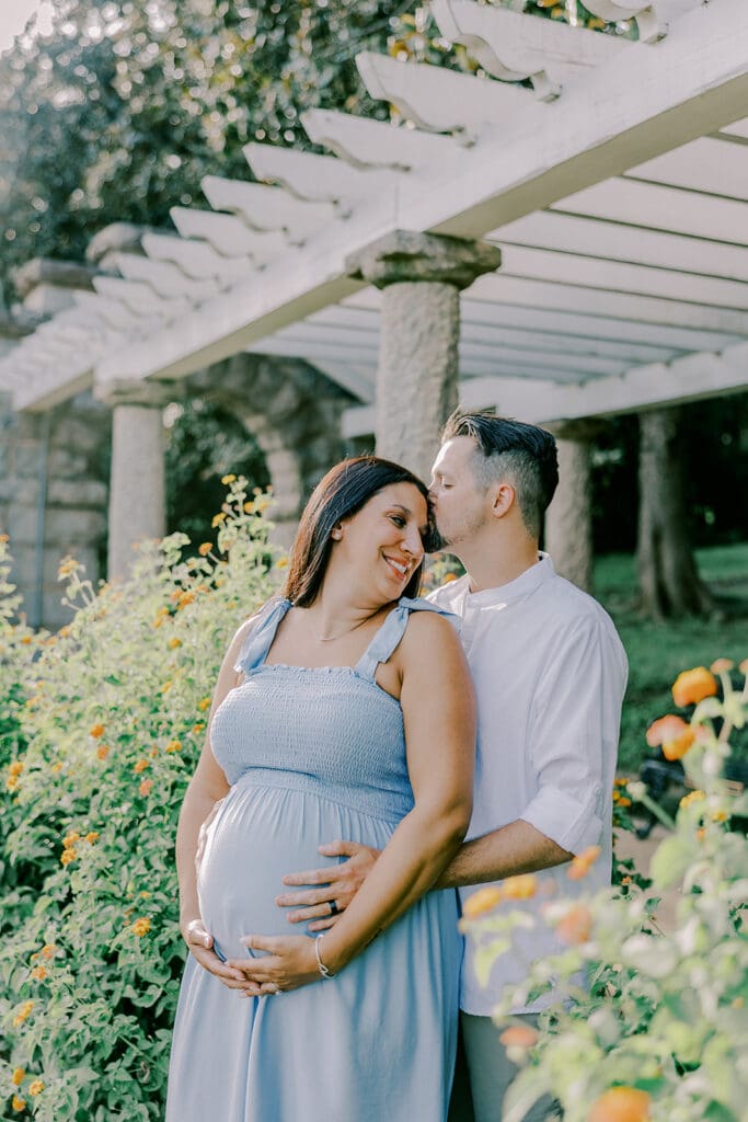 Maymont Richmond maternity photography session with the Barnes family surrounded by spring blooms and golden light.