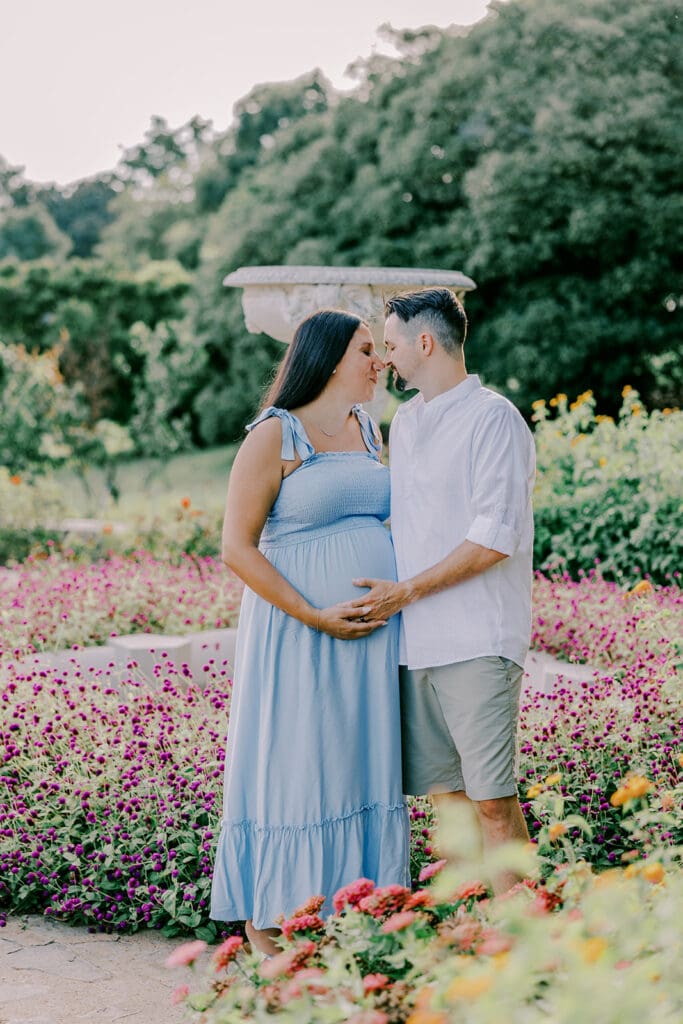 Maymont Richmond maternity photography session with the Barnes family surrounded by spring blooms and golden light.