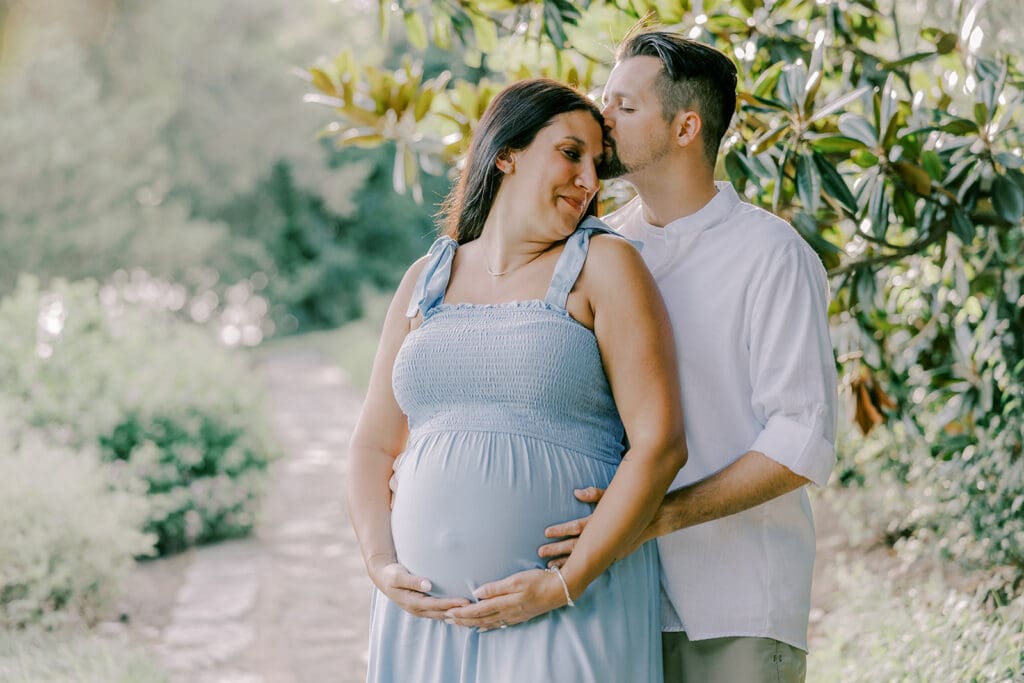 Maymont Richmond maternity photography session with the Barnes family surrounded by spring blooms and golden light.