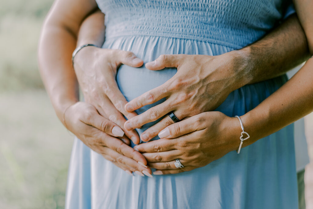 Maymont Richmond maternity photography session with the Barnes family surrounded by spring blooms and golden light.