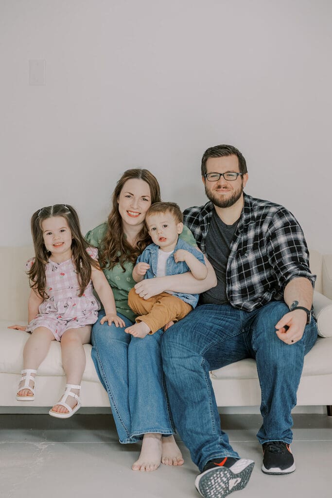 Richmond studio family photographer session with the Keeley family showing siblings and parents in a bright studio setting.