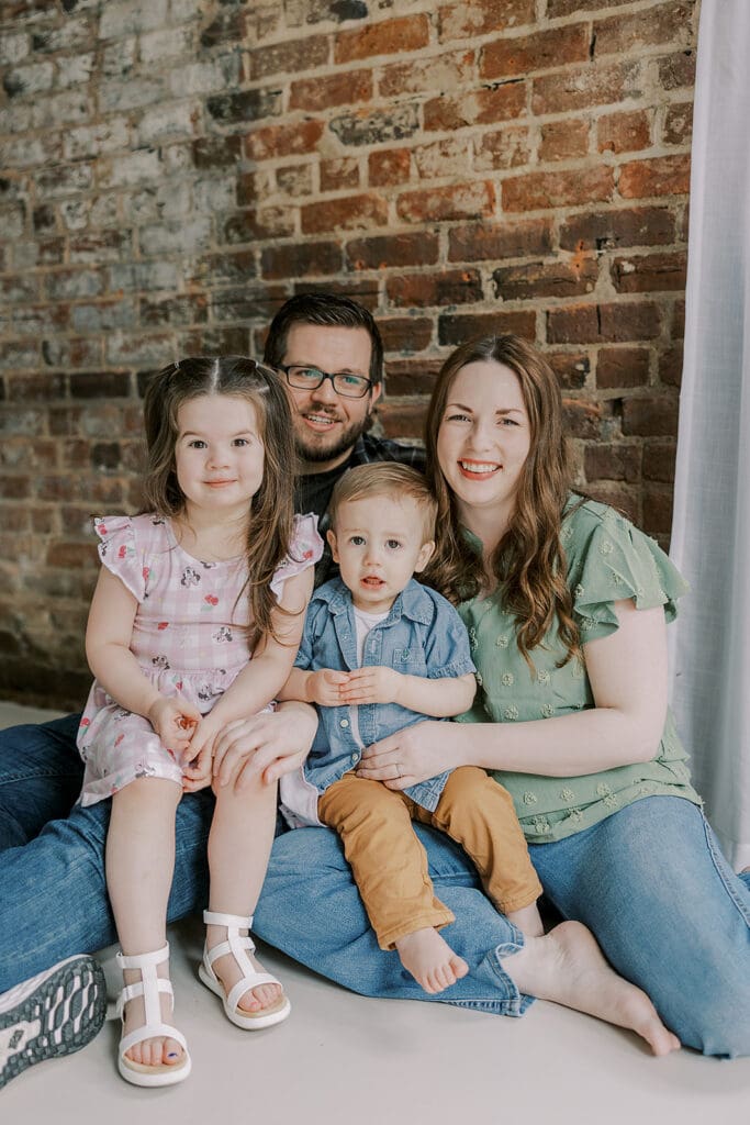 Richmond studio family photographer session with the Keeley family showing siblings and parents in a bright studio setting.