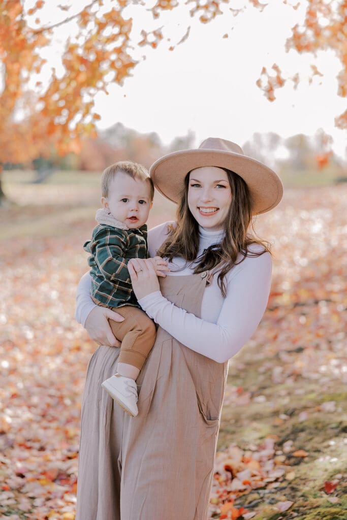 Richmond fall family photography session with the Keeley family surrounded by orange autumn leaves at Byrd Park.