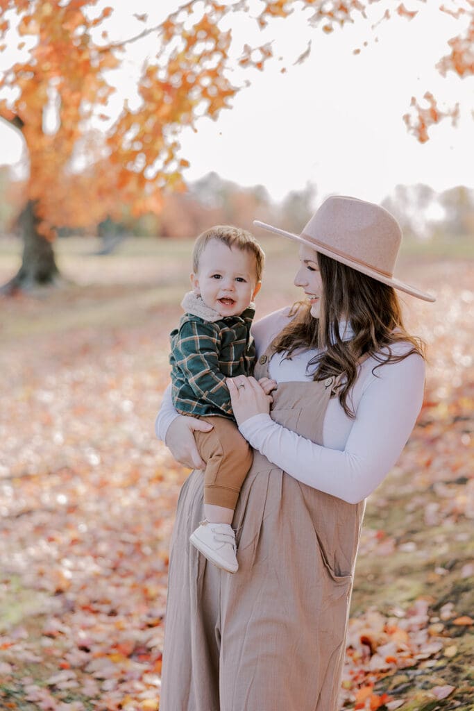 Richmond fall family photography session with the Keeley family surrounded by orange autumn leaves at Byrd Park.