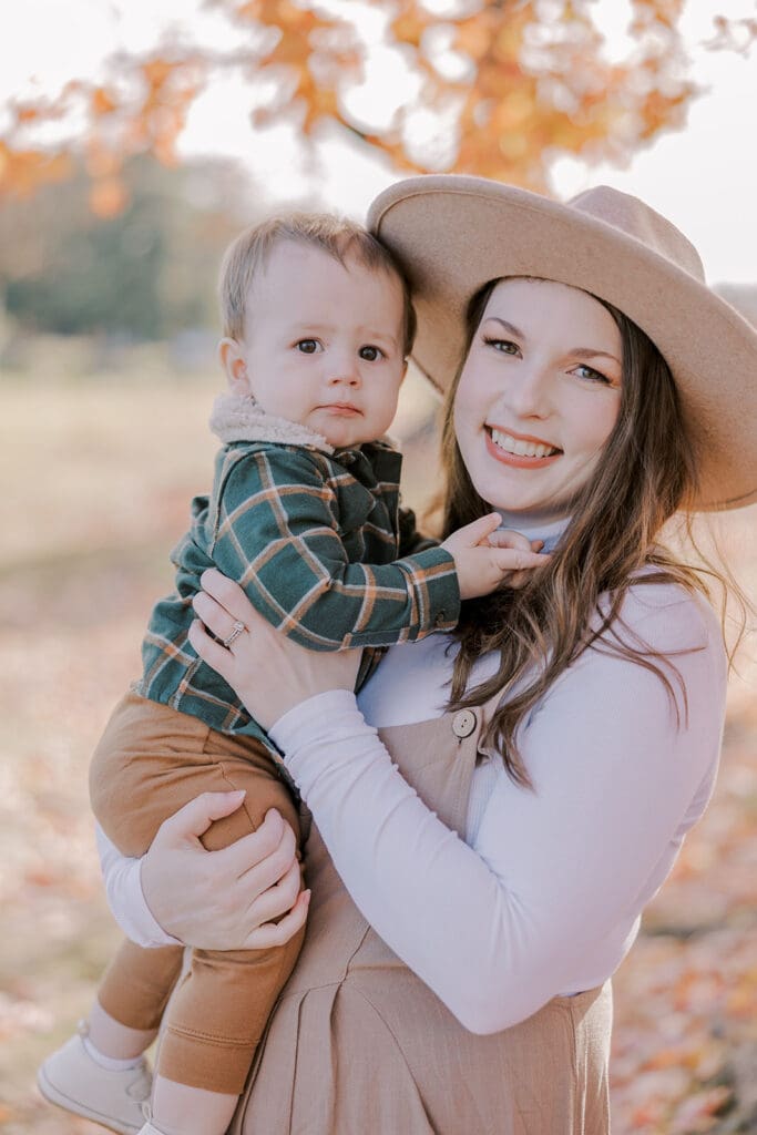 Richmond fall family photography session with the Keeley family surrounded by orange autumn leaves at Byrd Park.