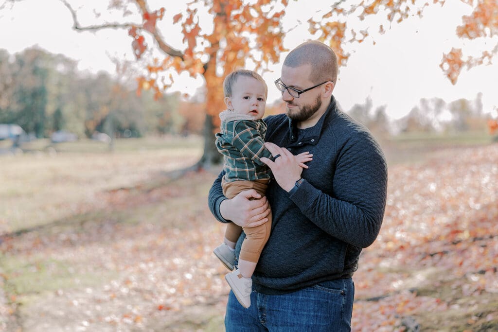 Richmond fall family photography session with the Keeley family surrounded by orange autumn leaves at Byrd Park.