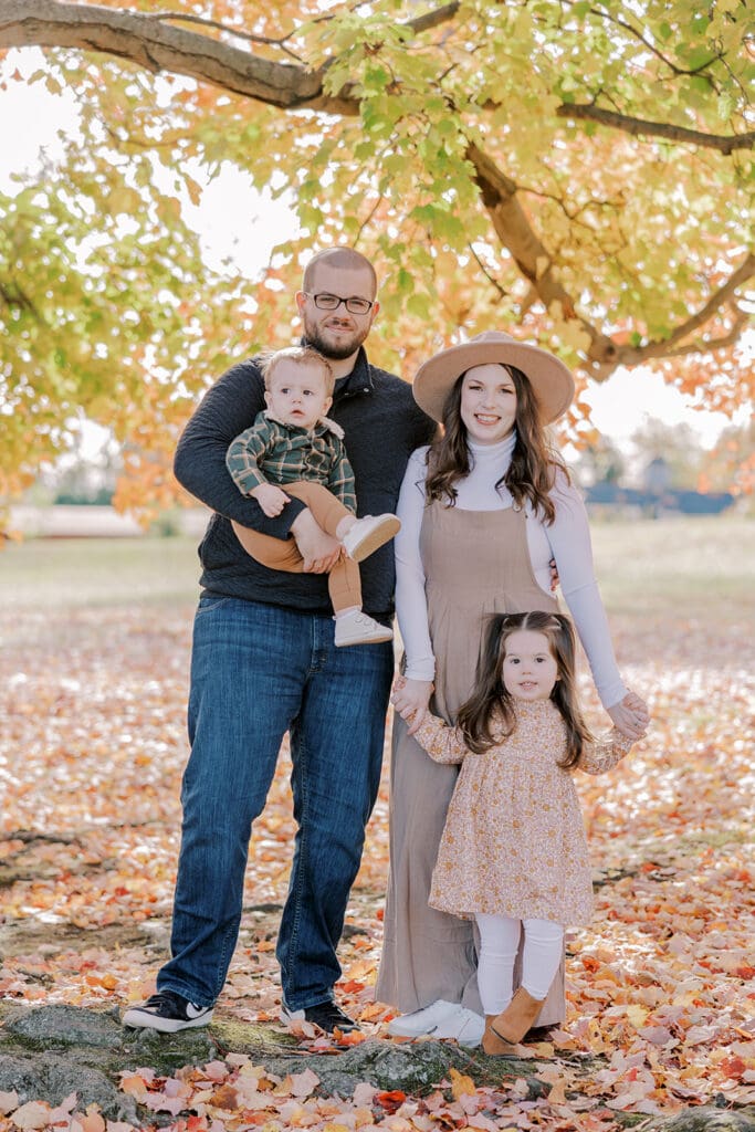 Richmond fall family photography session with the Keeley family surrounded by orange autumn leaves at Byrd Park.