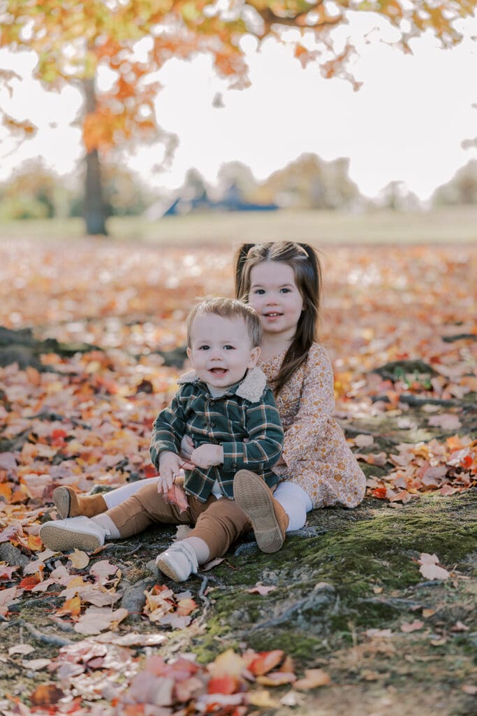 Richmond fall family photography session with the Keeley family surrounded by orange autumn leaves at Byrd Park.