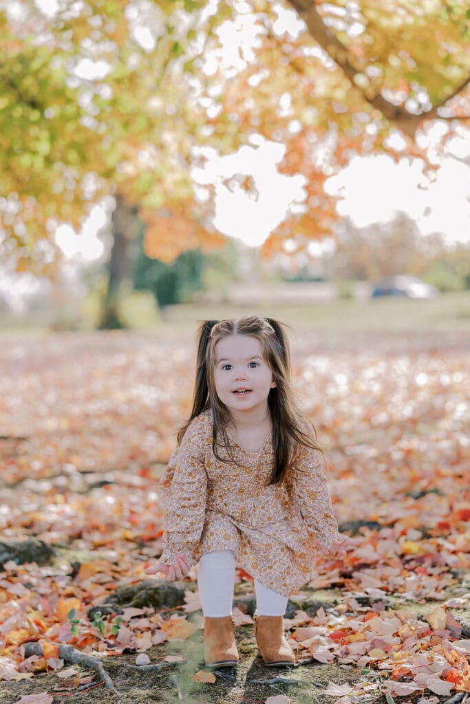 Richmond fall family photography session with the Keeley family surrounded by orange autumn leaves at Byrd Park.