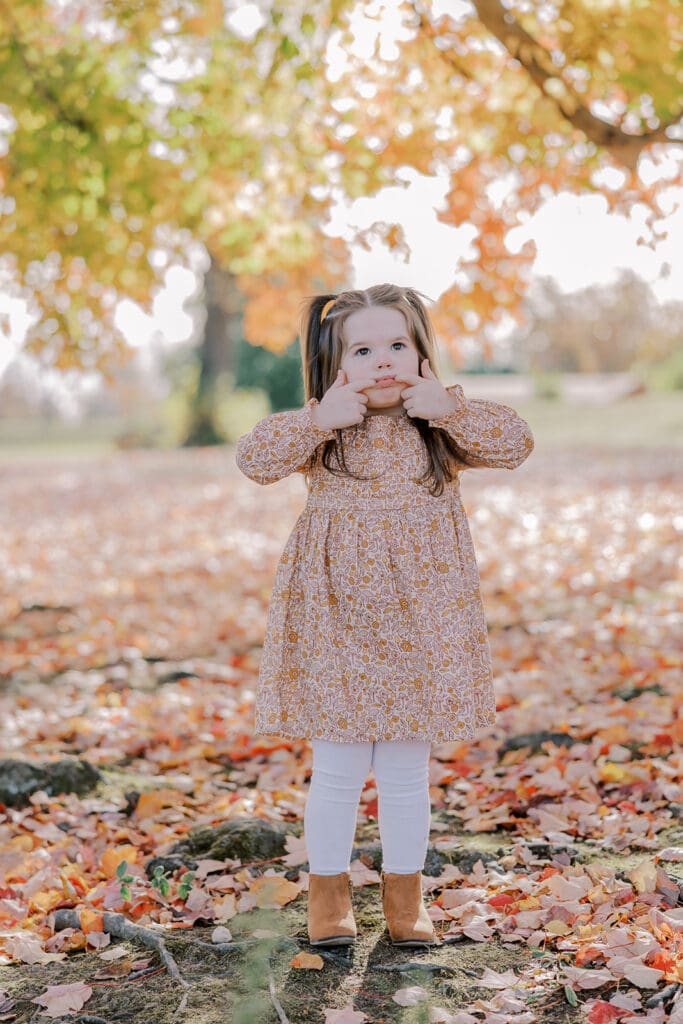 Richmond fall family photography session with the Keeley family surrounded by orange autumn leaves at Byrd Park.