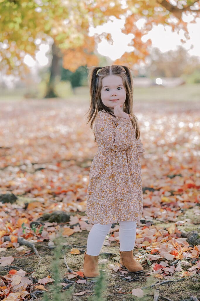 Richmond fall family photography session with the Keeley family surrounded by orange autumn leaves at Byrd Park.