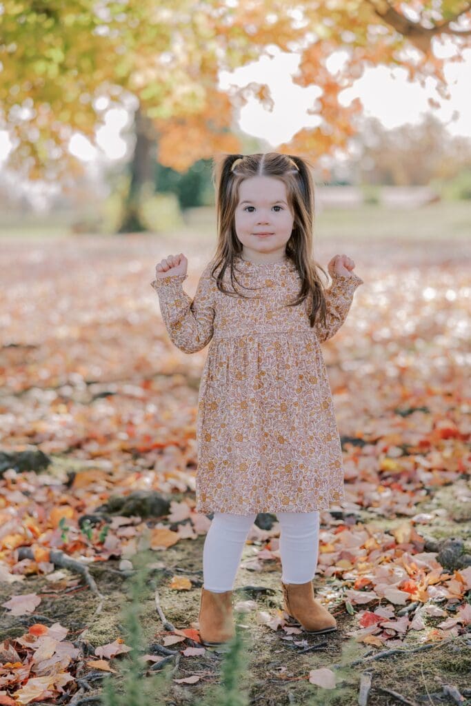 A child poses during her Richmond fall family portraits.