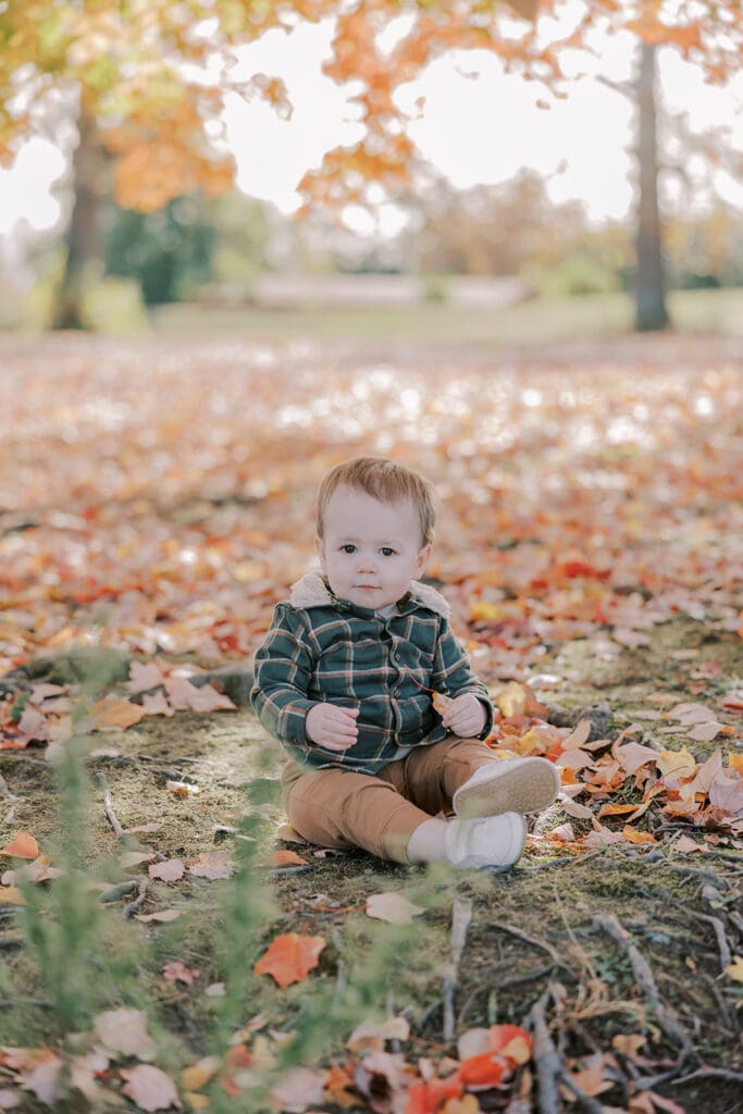 Richmond fall family photography session with the Keeley family surrounded by orange autumn leaves at Byrd Park.