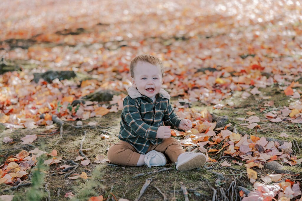 Richmond fall family photography session with the Keeley family surrounded by orange autumn leaves at Byrd Park.