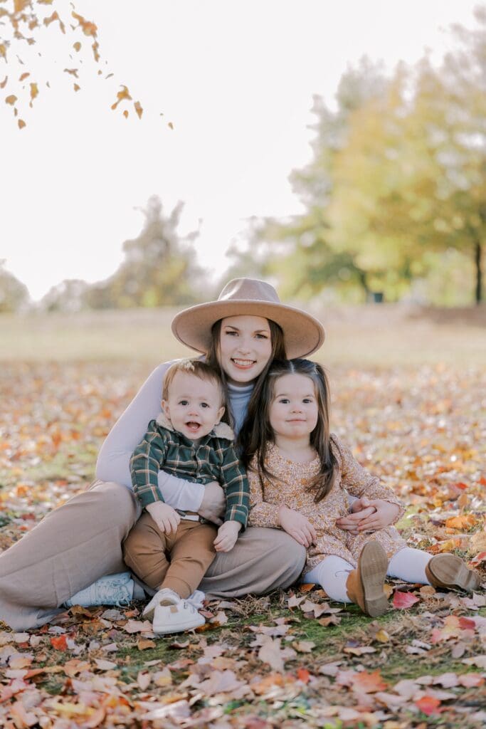 A mother and her children posing at Byrd Park during their Richmond family portraits