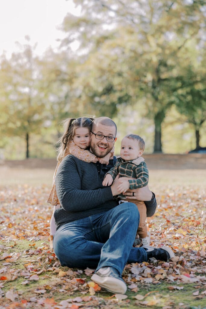 Richmond fall family photography session with the Keeley family surrounded by orange autumn leaves at Byrd Park.