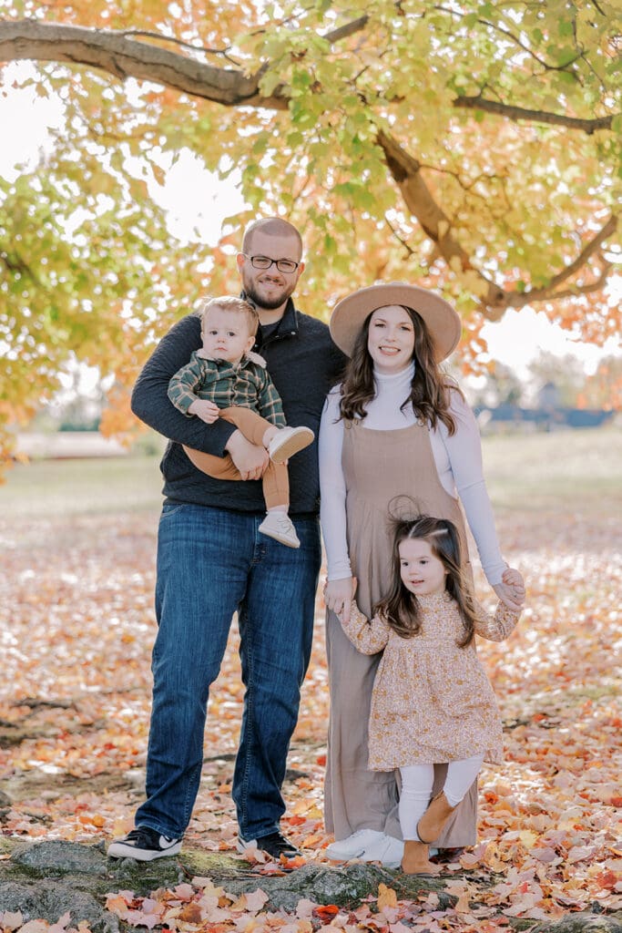 Richmond fall family photography session with the Keeley family surrounded by orange autumn leaves at Byrd Park.