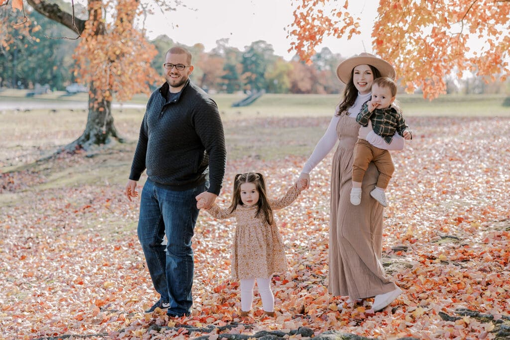 Richmond fall family photography session with the Keeley family surrounded by orange autumn leaves at Byrd Park.