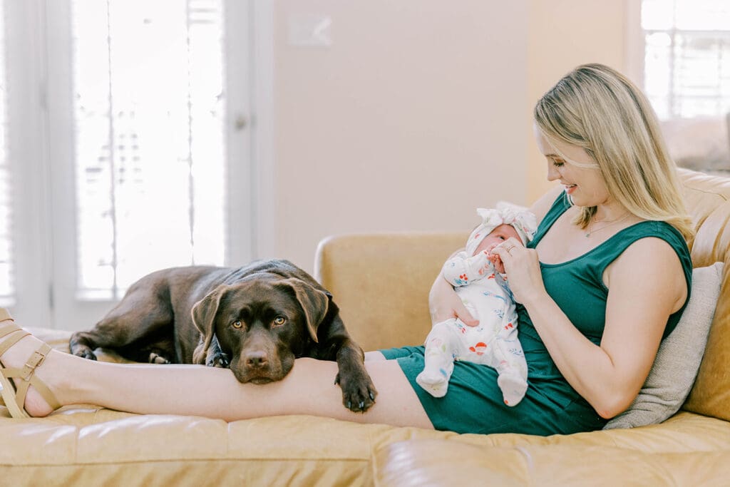 Richmond lifestyle newborn photographer session showing the Quick family with their new baby girl in their home.