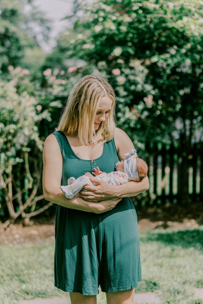 Richmond lifestyle newborn photographer session showing the Quick family with their new baby girl in their home.