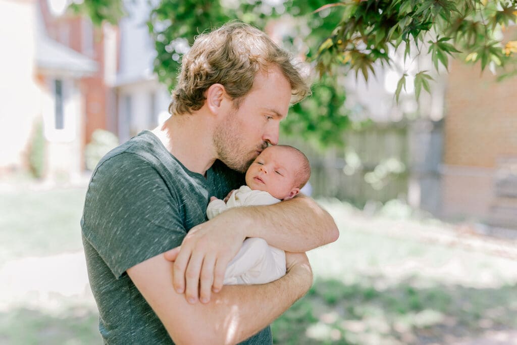 Richmond in-home lifestyle newborn session showing the Roost family with their baby in a purple-themed nursery and outdoor spring portraits.