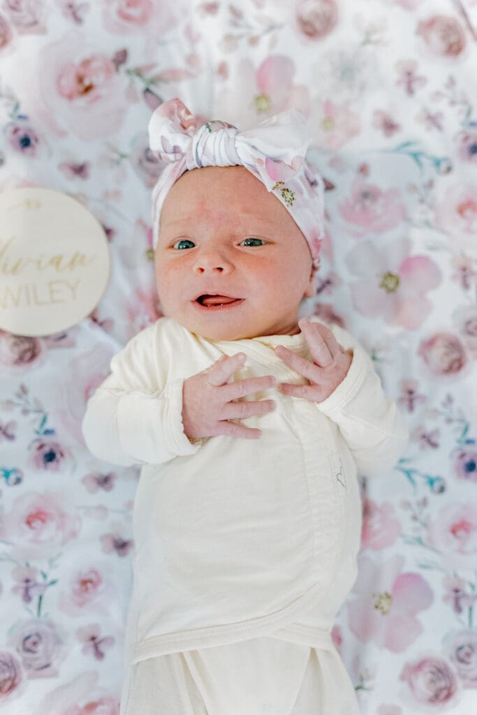 Richmond in-home lifestyle newborn session showing the Roost family with their baby in a purple-themed nursery and outdoor spring portraits.