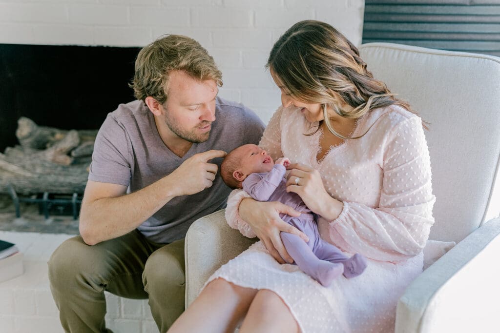 Richmond in-home lifestyle newborn session showing the Roost family with their baby in a purple-themed nursery and outdoor spring portraits.