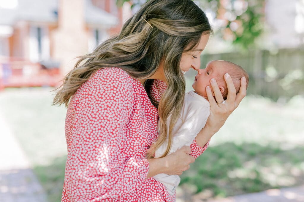 Richmond in-home lifestyle newborn session showing the Roost family with their baby in a purple-themed nursery and outdoor spring portraits.